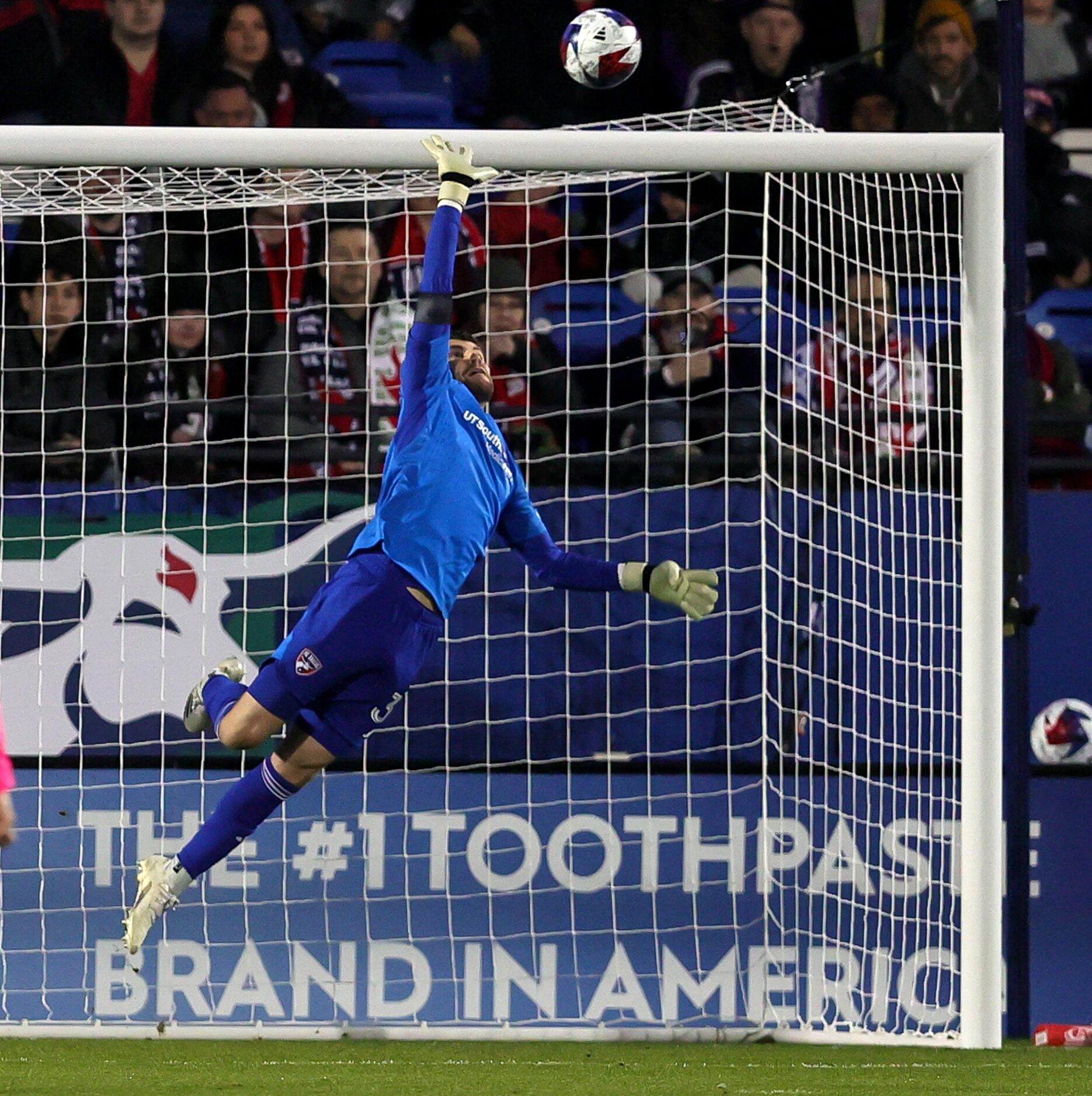 FC Dallas goalkeeper Maarten Paes makes a save against Minnesota United during the first...