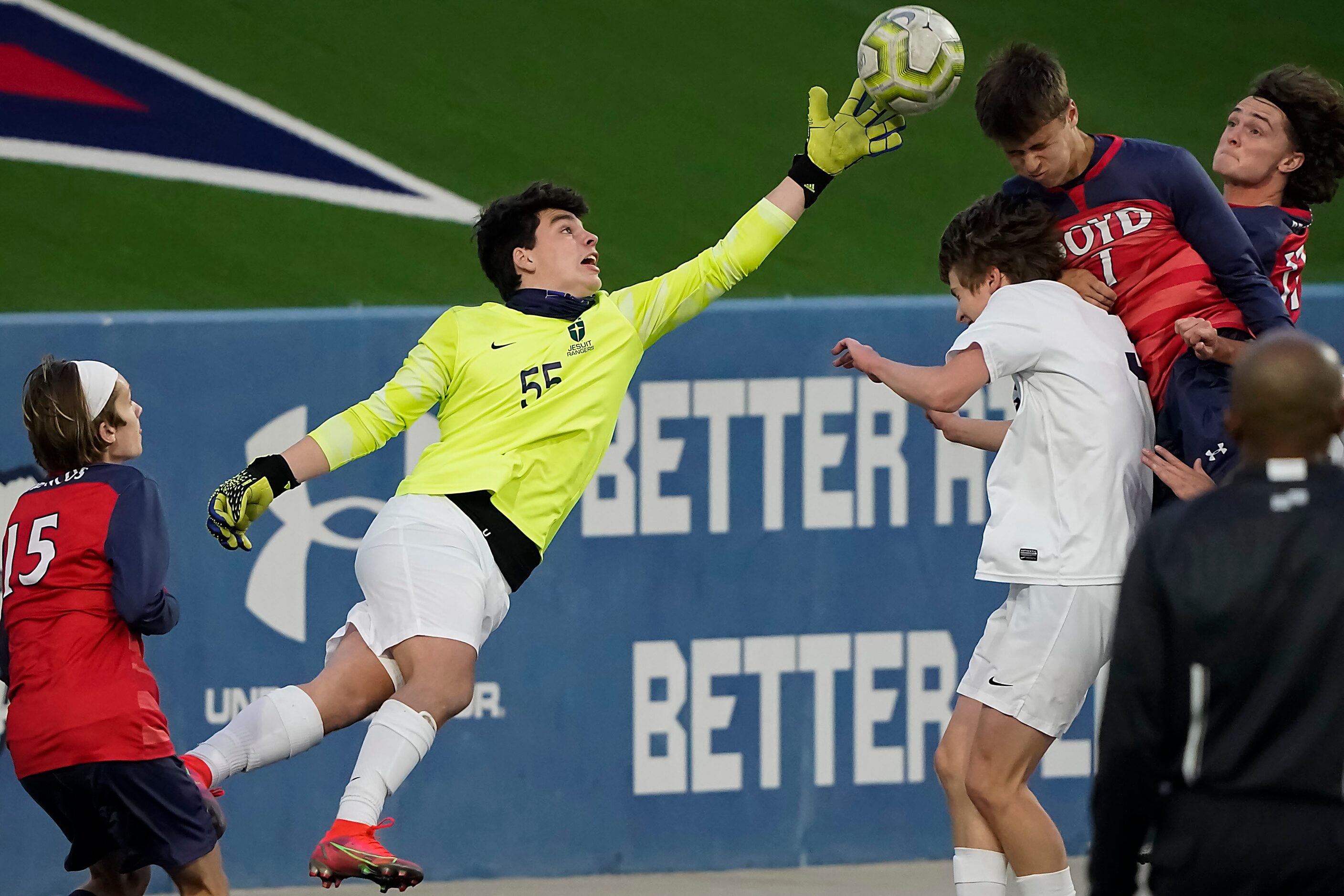 Jesuit goalkeeper Cole Hines (55) knocks a corner kick away from McKinney Boyd forward...