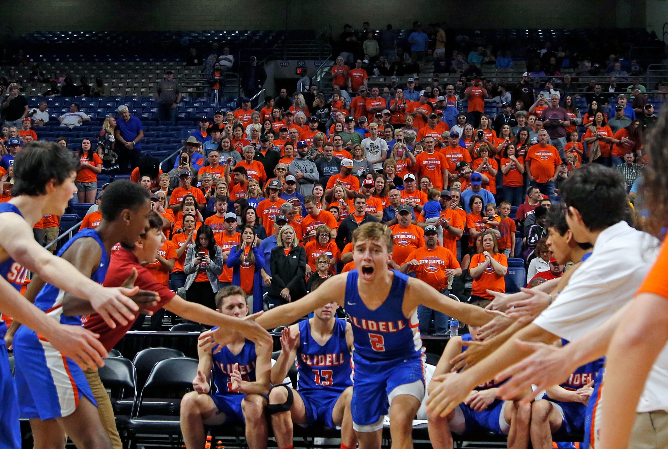 Slidell fans stand during introduction as Slidell guard Jaden Luttrell #2 runs onto the...