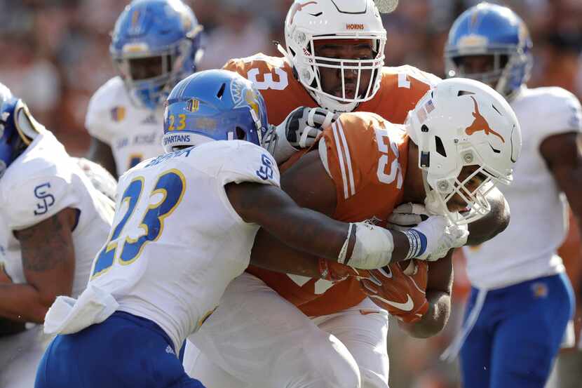 FILE - In this Sept. 9, 2017, file photo, Texas running back Chris Warren III (25) scores a...