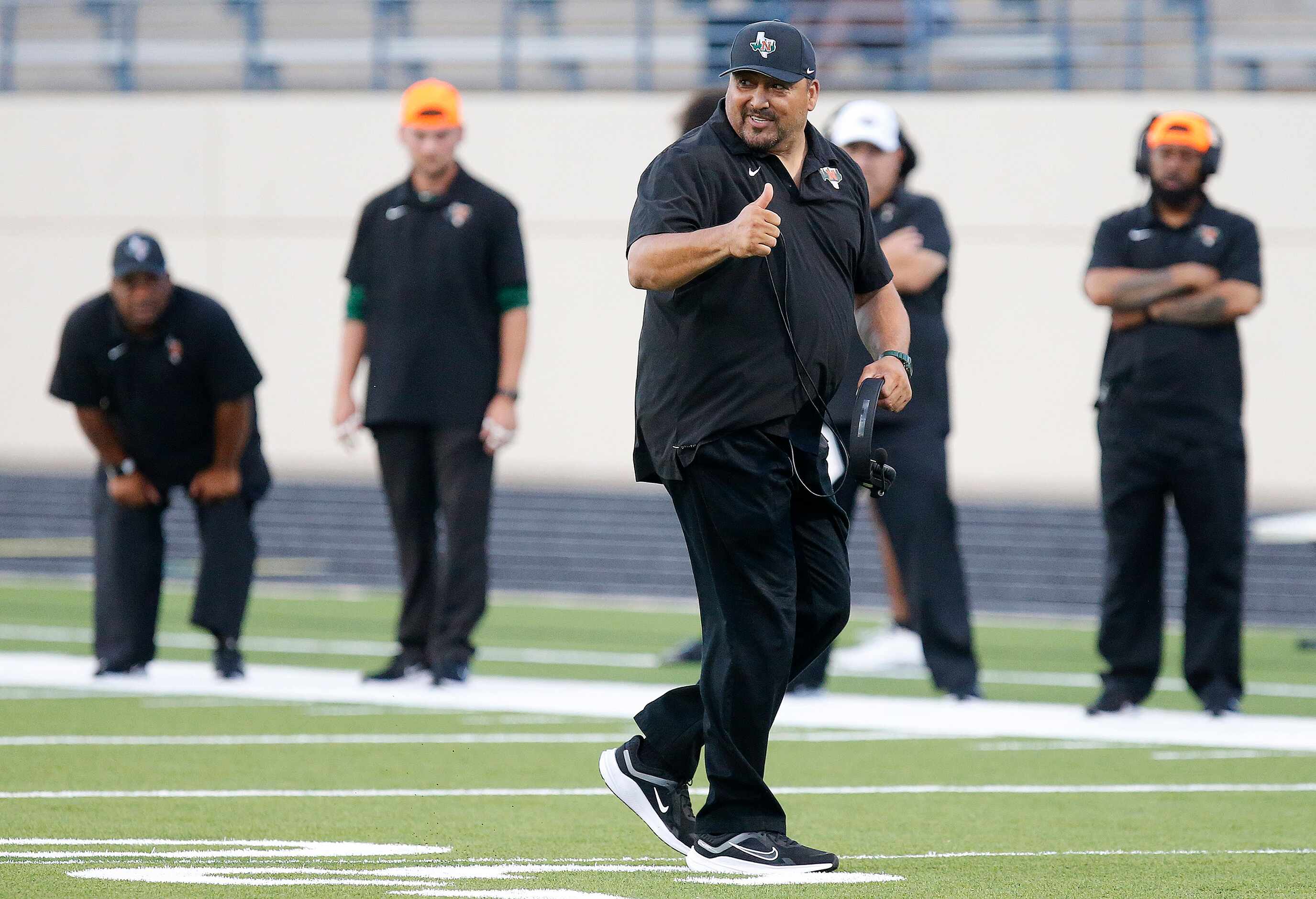 Naaman Forrest High School head coach Jesse Perales temporarily stopped play to check on a...