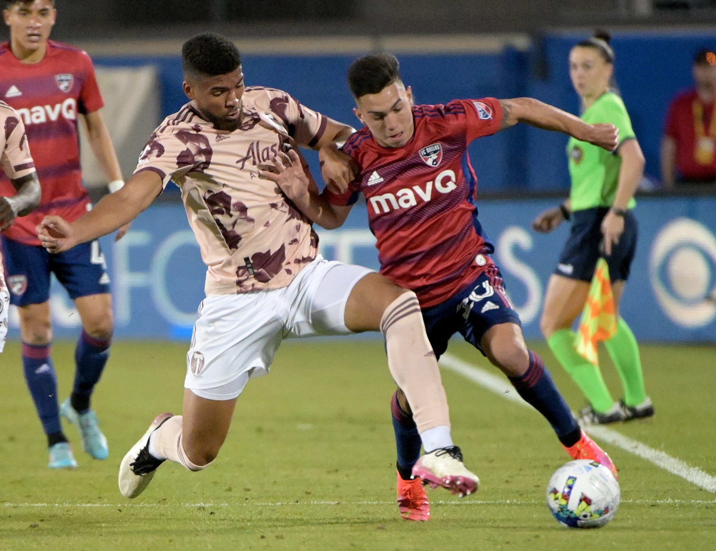 FC Dallas forward Alan Velasco (20) goes after a ball with Portland Timbers defender Zac...