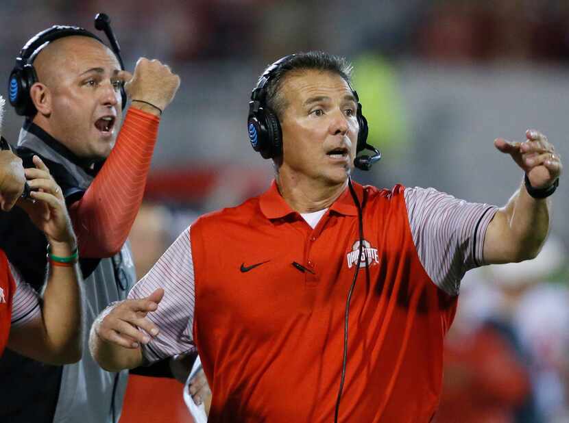 FILE - In this Sept. 17, 2016, file photo, Ohio State head coach Urban Meyer, right, and...