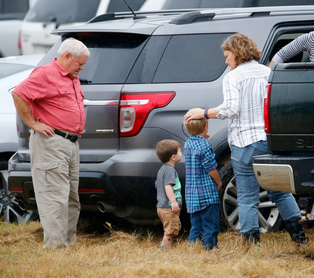 People come to the temporary First Baptist Church at a baseball field in Sutherland Springs,...