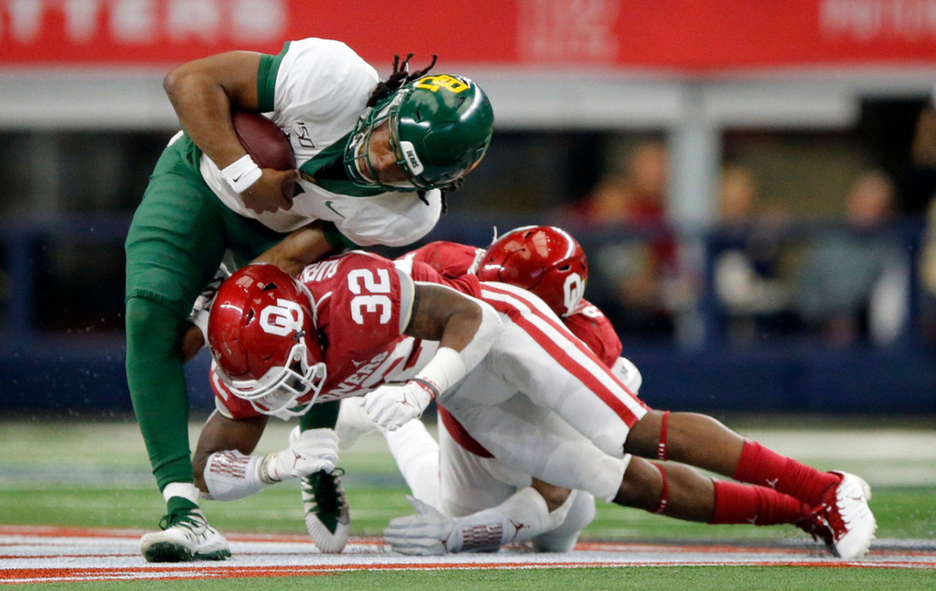 Oklahoma Sooners safety Delarrin Turner-Yell (32) takes down Baylor Bears quarterback Gerry...