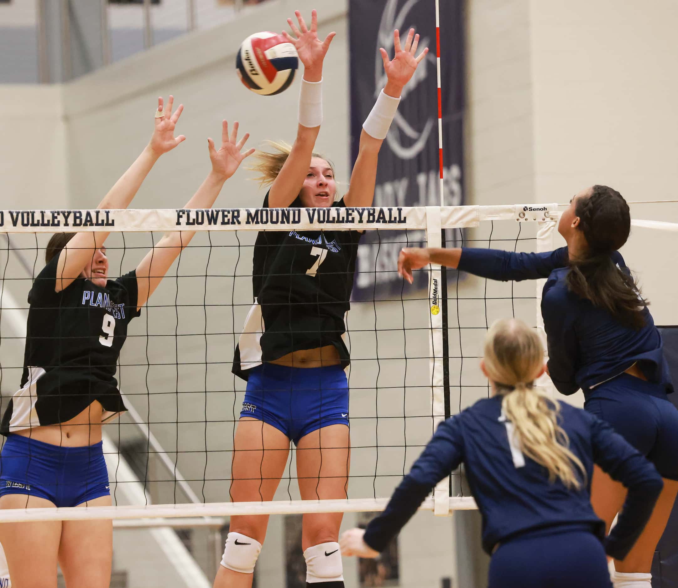 Plano West Senior High School Ansley Denison (9) and Blaire Bayless (7) jump attempting to...