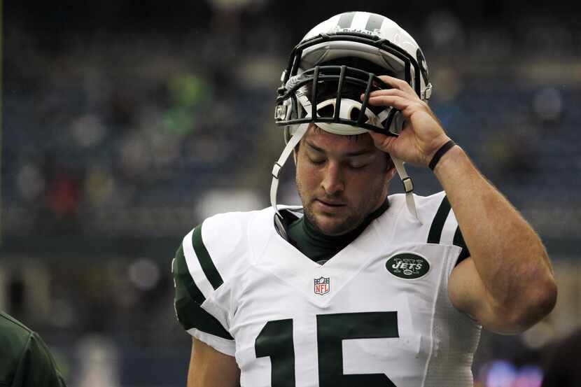 FILE - This Nov. 11, 2012 file photo shows New York Jets' Tim Tebow on the field before an...