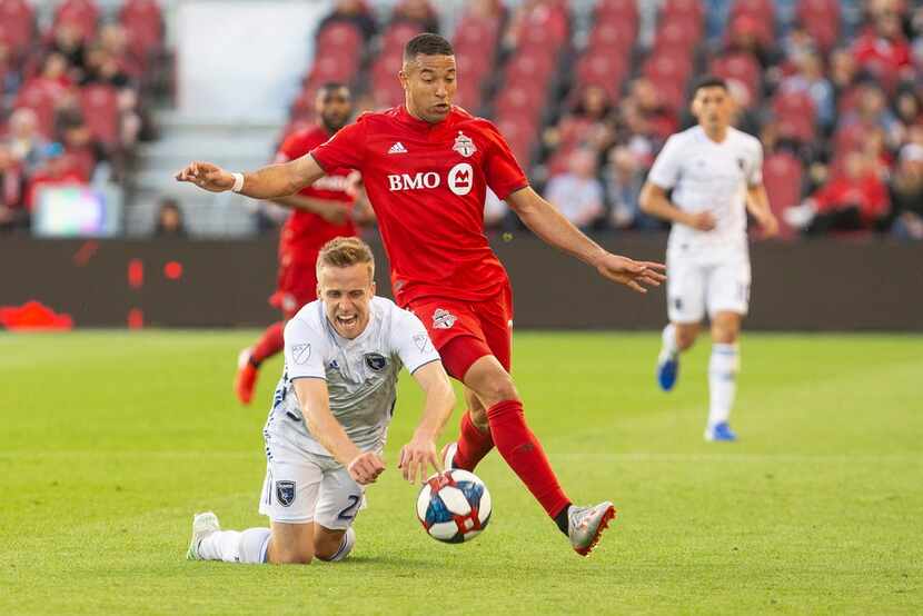 San Jose Earthquakes' Tommy Thompson, left, is fouled by Toronto FC's Justin Morrow during...