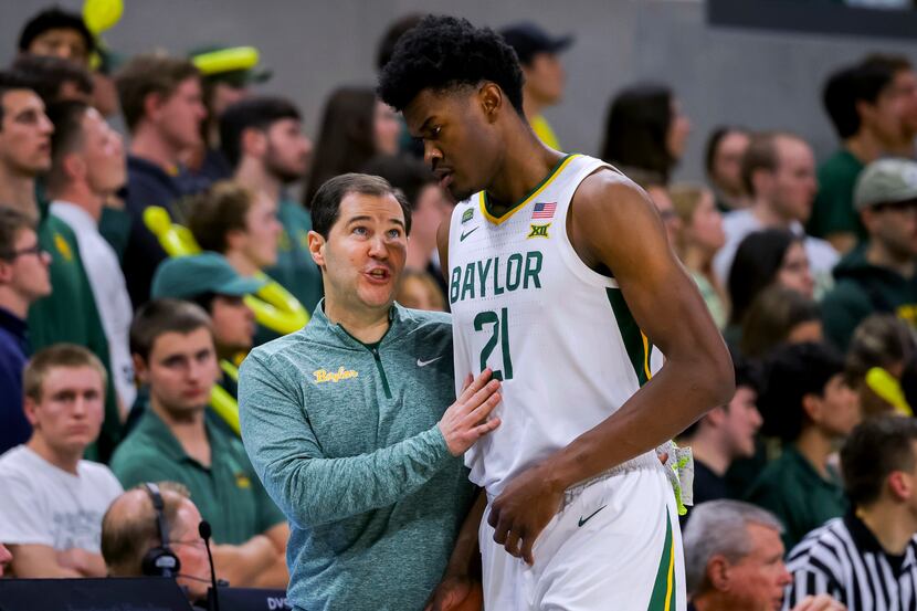 Baylor coach Scott Drew talks with center Yves Missi during the second half of the team's...