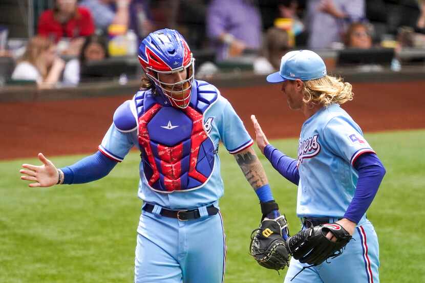 Texas Rangers starting pitcher Mike Foltynewicz celebrates with catcher Jonah Heim after...