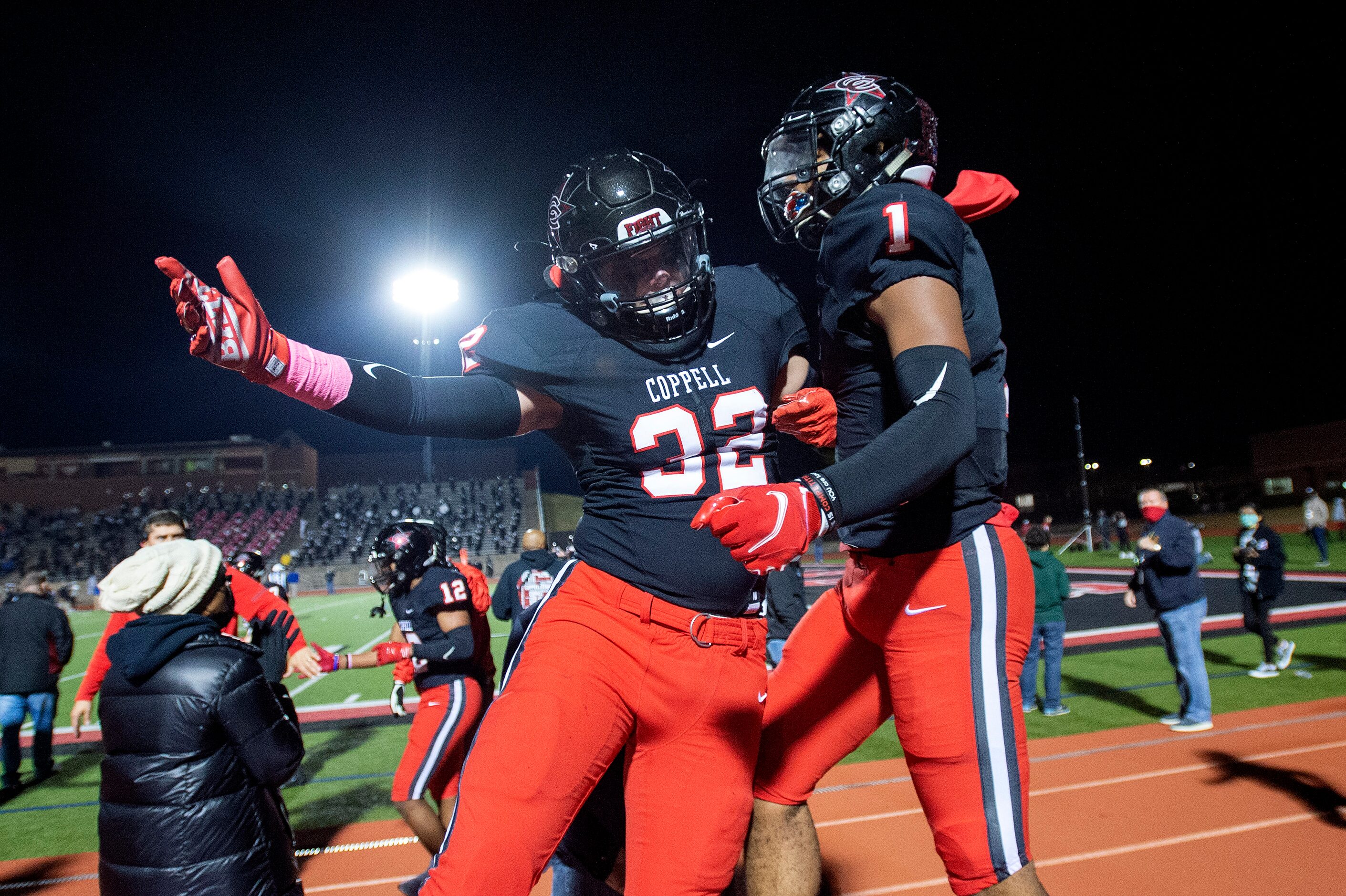 Coppell senior linebacker Jackson Durbin (32) celebrates with senior wide receiver KJ...