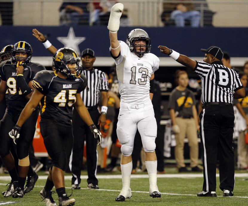 Denton Guyer High Logan Helel (13) celebrates his recovery of a turnover during the first...