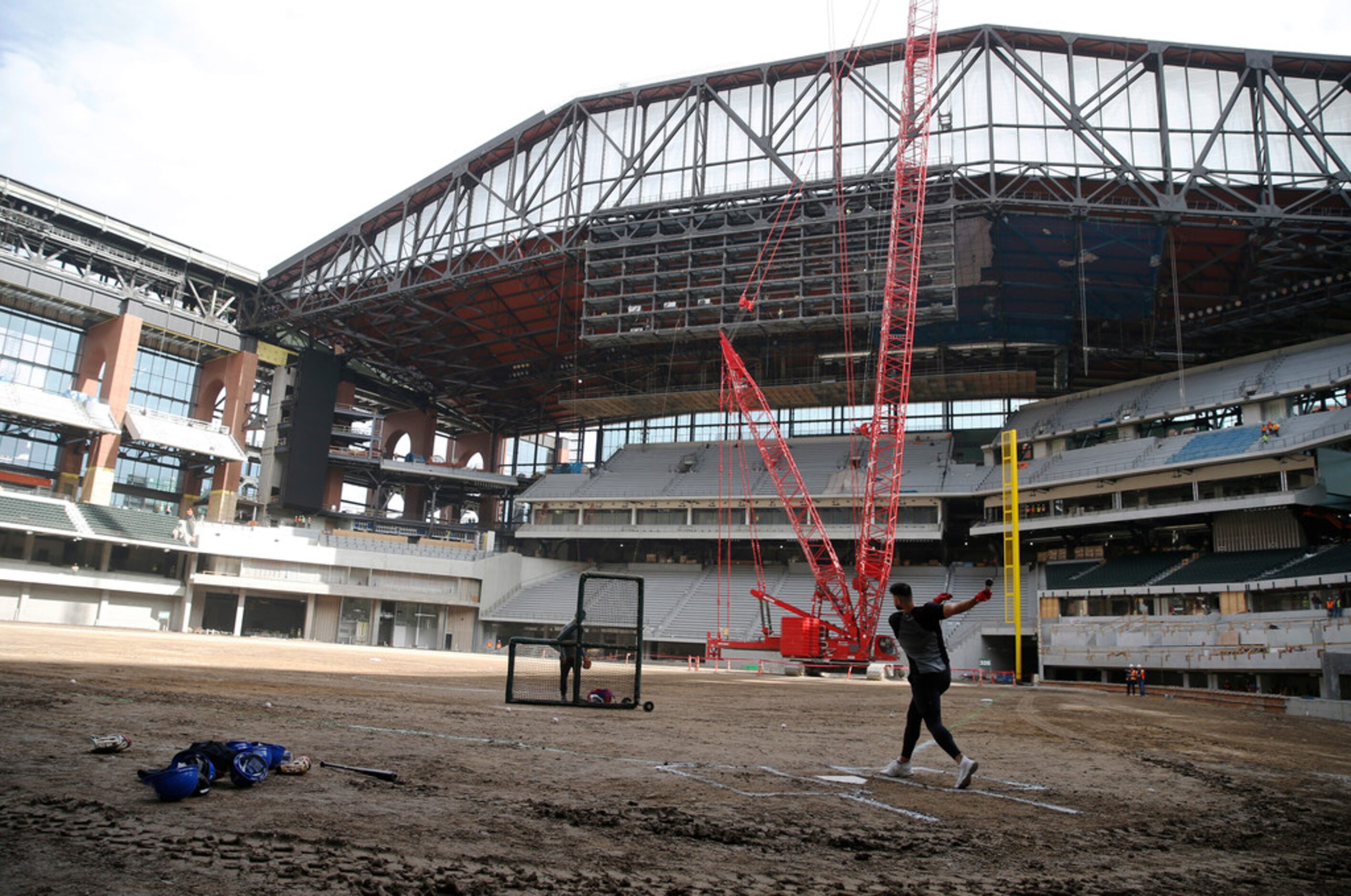 Texas Rangers Joey Gallo watches the ball soar after hitting the ball at Globe Life Field in...