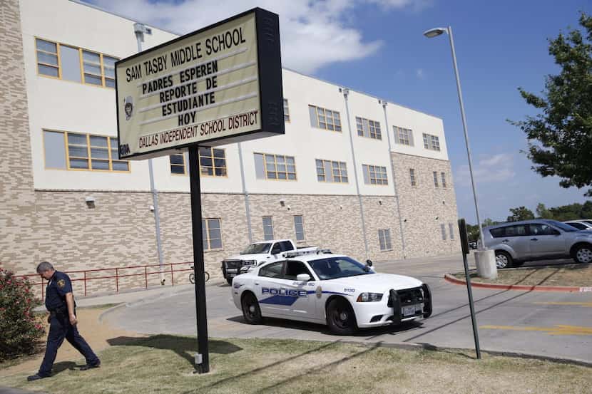 Dallas ISD police outside Tasby Middle School in 2014 as they patrolled the campus' main...