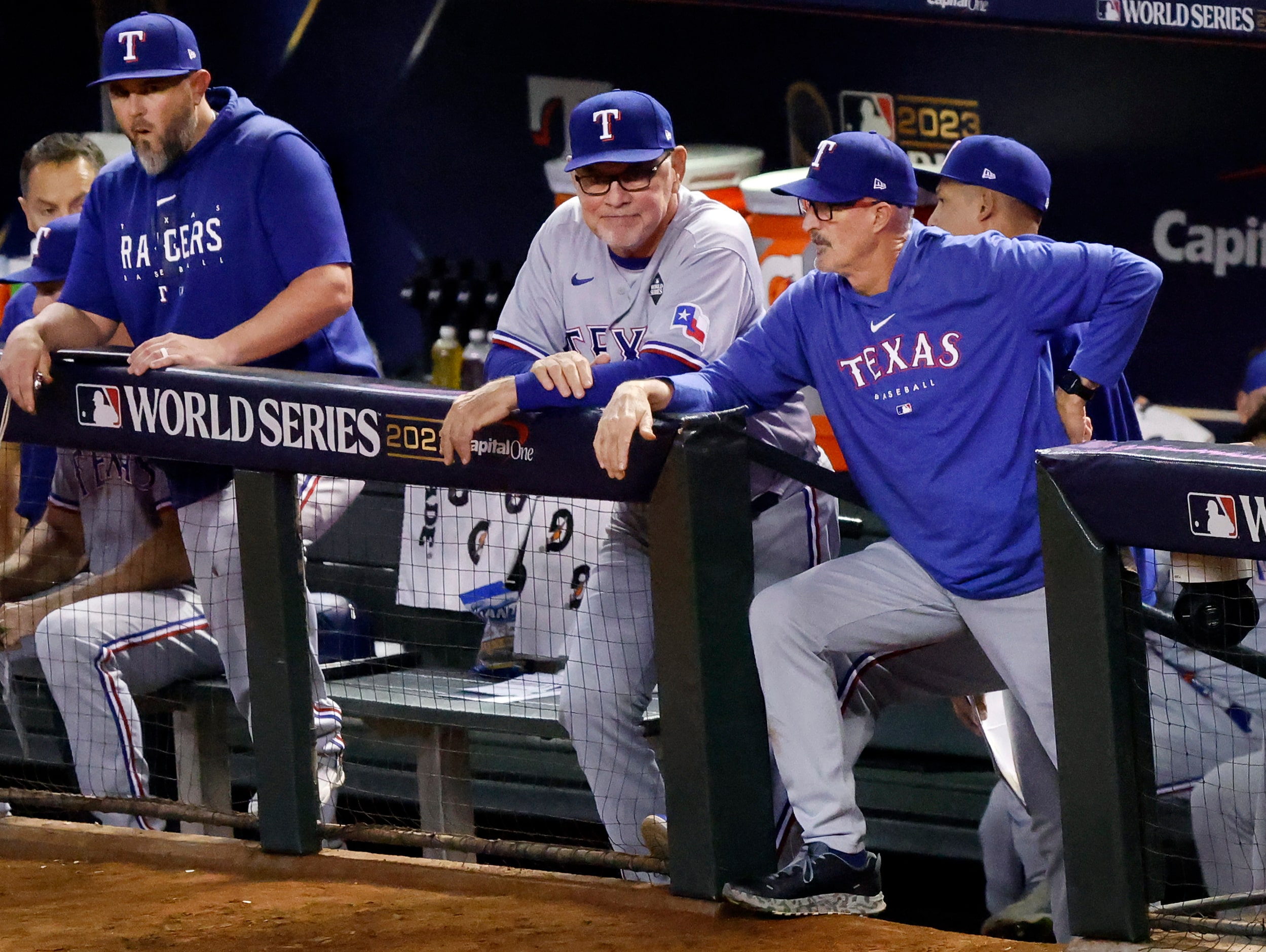 Texas Rangers pitching coach Mike Maddux and manager Bruce Bochy watch their squad face the...