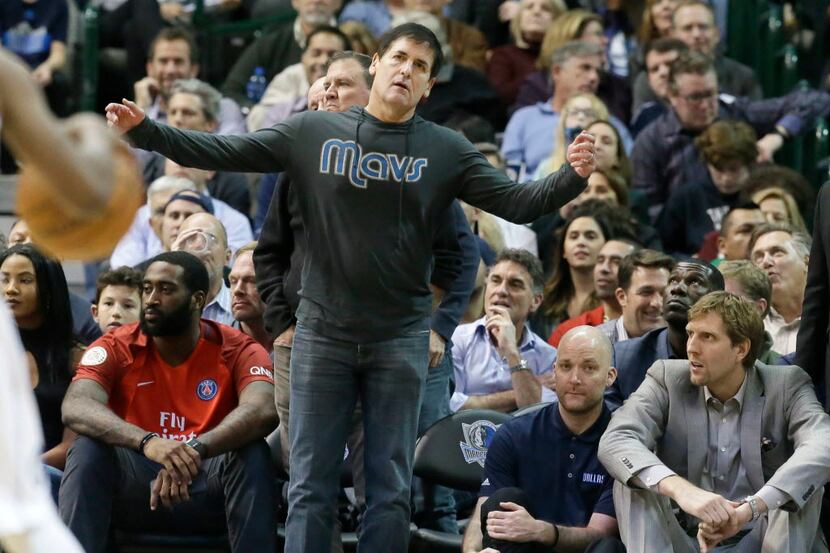 Mavericks owner Mark Cuban reacts to a call during the second half of an NBA game between...