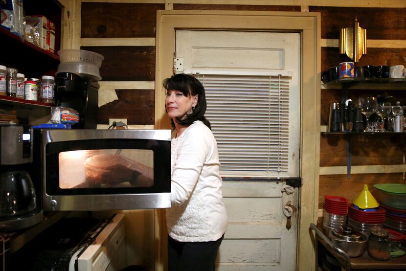 Dawn, reheating spaghetti sauce before dinner, calls student loan debt her "quiet reality."  