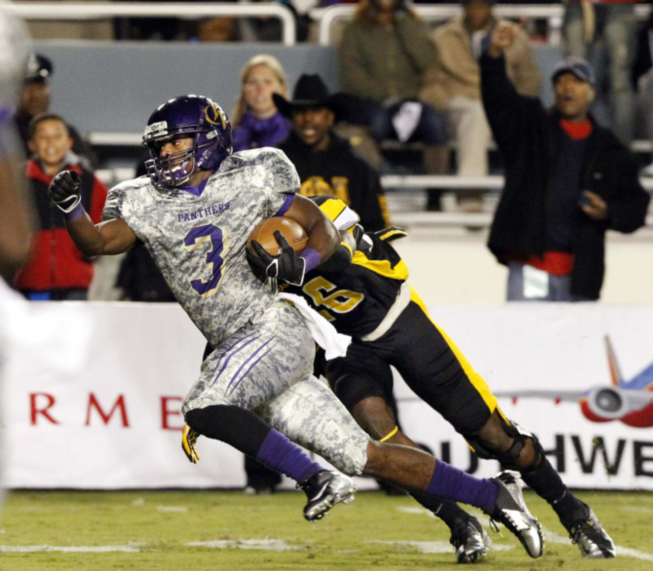 Prairie View A&M running back Johnta Hebert (3) eludes Grambling defensive back Naquan Smith...