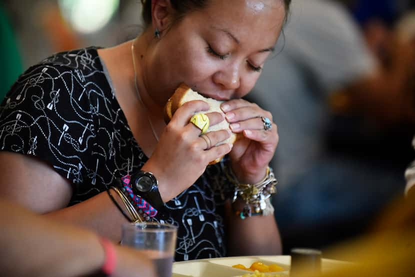 Belinda Cleary sits at a table with other guests during National Hunger Awareness Day at The...