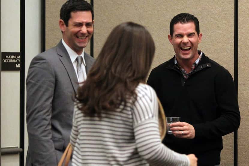 Former Texas Rangers infielder Michael Young, right, shares a laugh with wife Cristina...