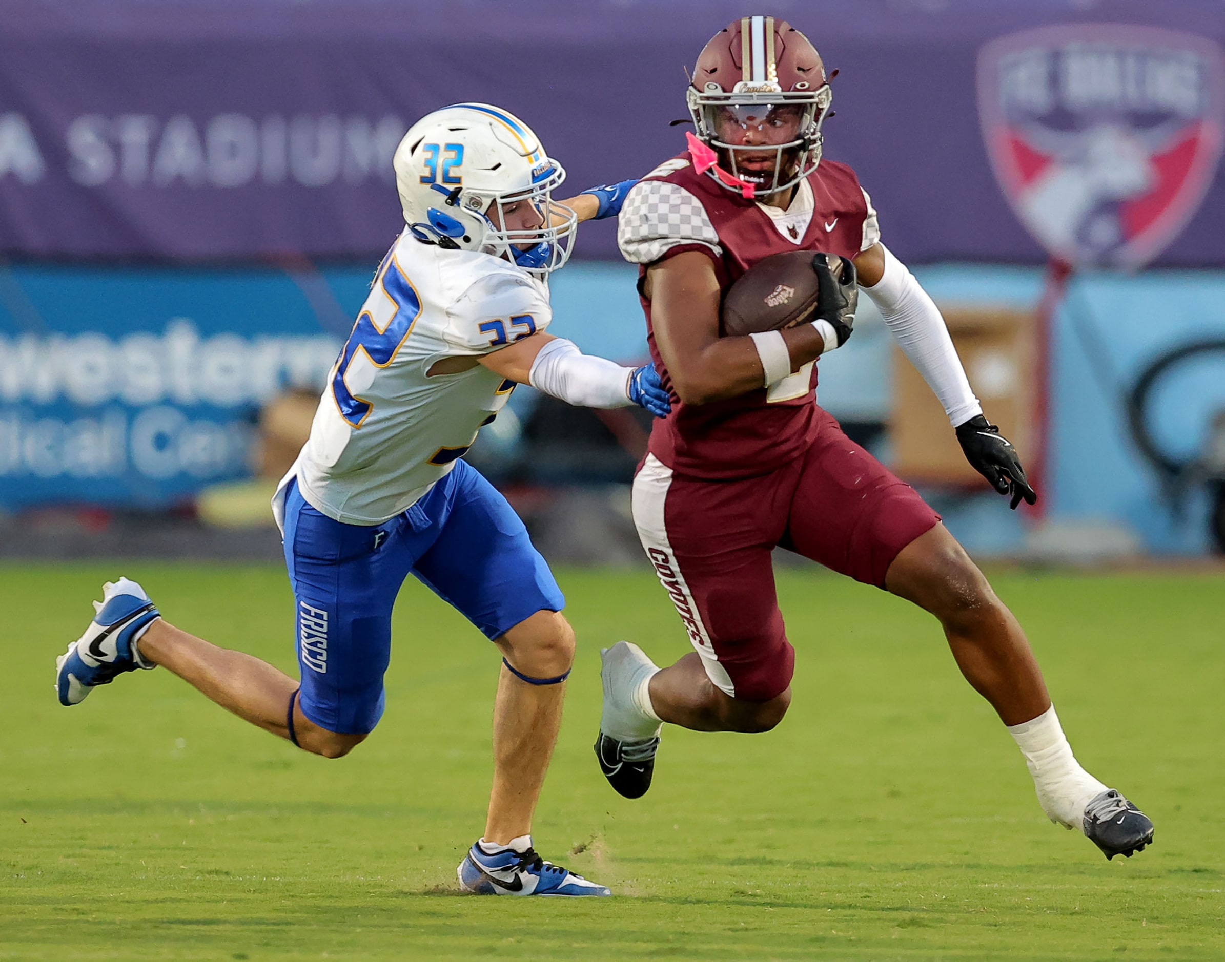 Frisco Heritage wide receiver Tatum Bell (2) tries to avoid Frisco defensive back Evan...