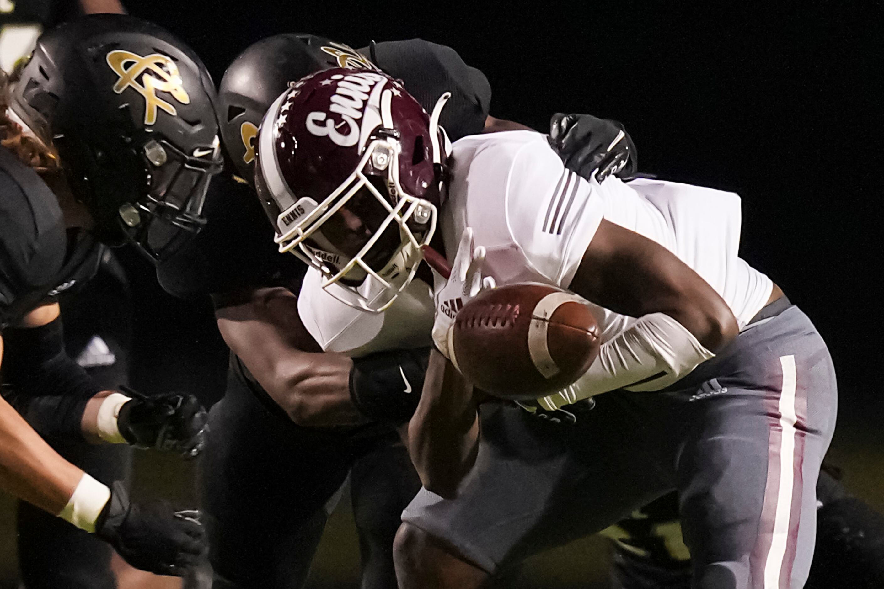 Ennis running back Dee Johnson (2) fumbles on a hit from Royse City linebacker Christian...