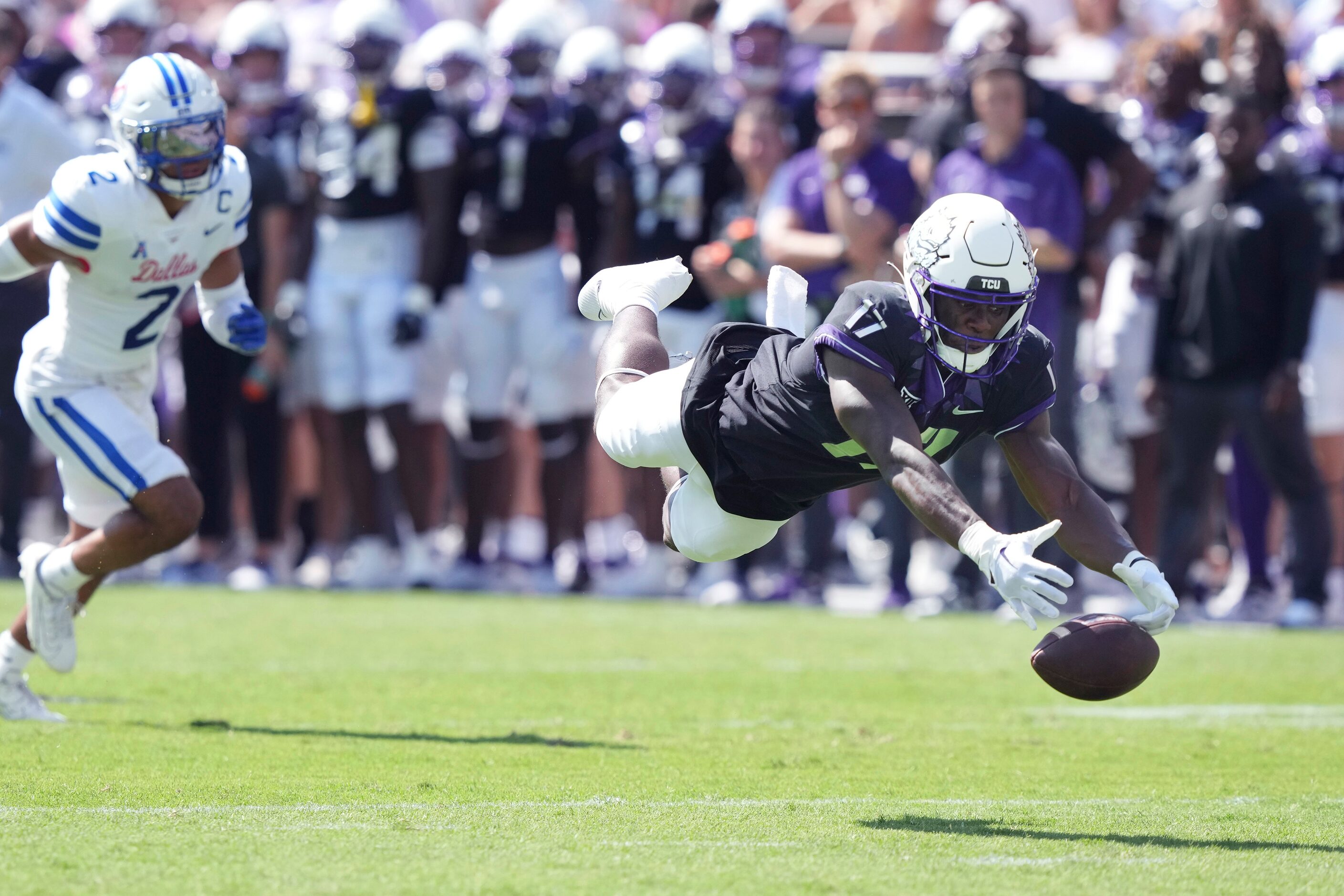 TCU running back Trent Battle (17) can't reach a pass in front of SMU safety Jonathan McGill...