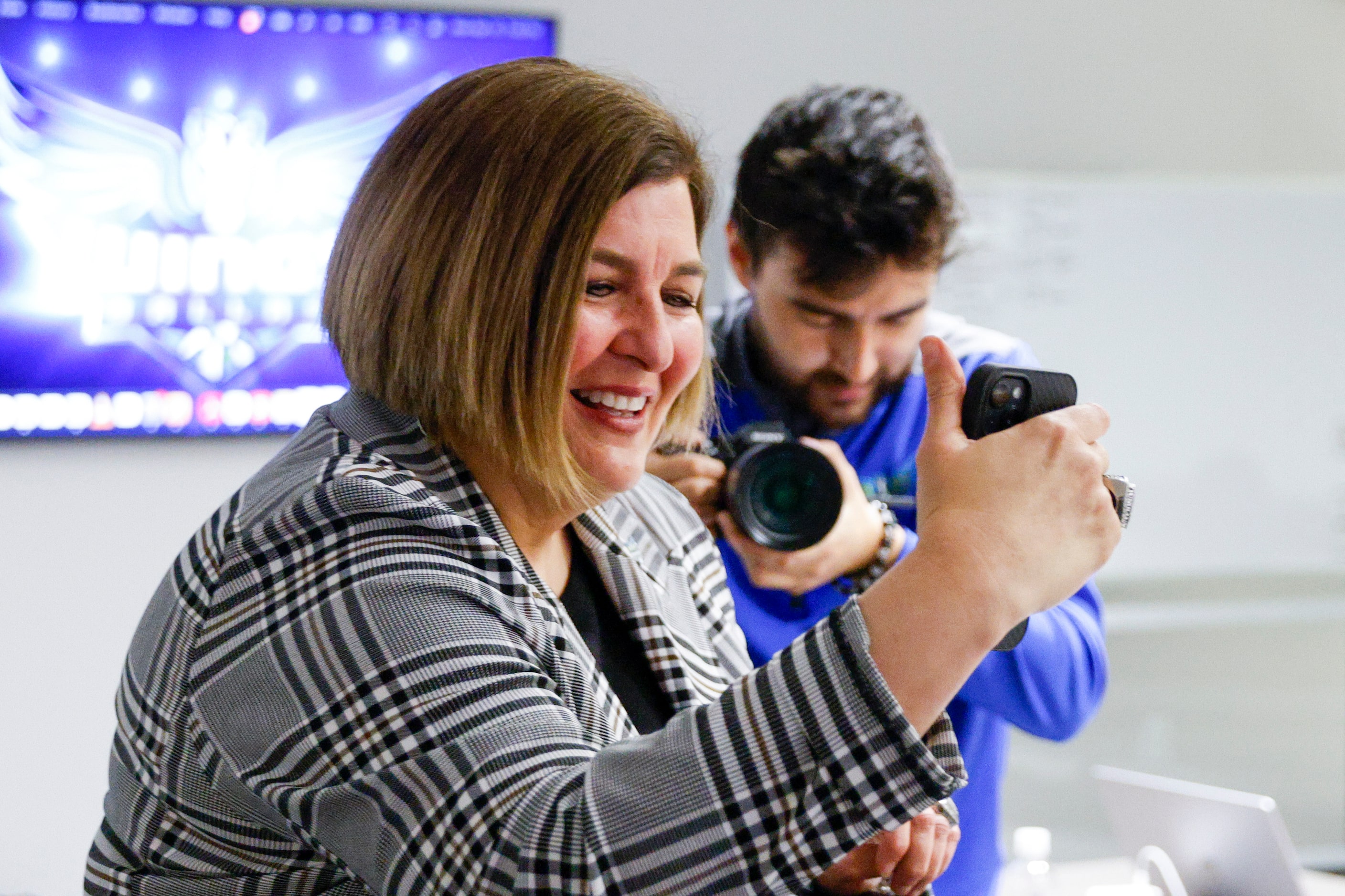 Dallas Wings head coach Latricia Trammell FaceTimes Maddy Siegrist of Villanova, third...