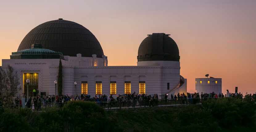 People gather at the Griffith Observatory of Mount Hollywood in Los Angeles' Griffith Park...