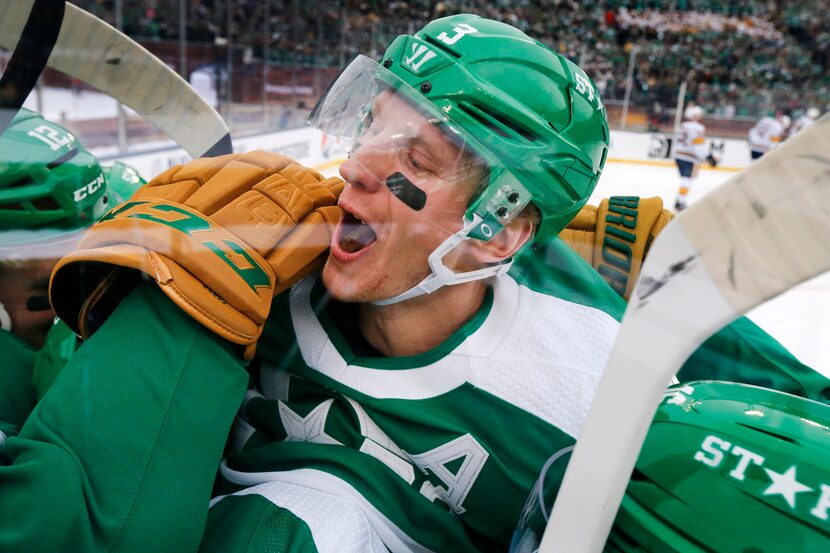 Dallas Stars defenseman John Klingberg (3) joins the celebration after Andrej Sekera scored...