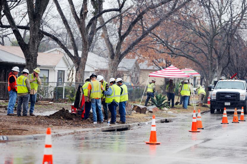 Construction crews work on gas lines near the intersection of Bowman Blvd and Chireno Street...