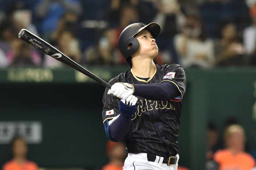 Japan's Shohei Ohtani follows a double in the seventh inning during the international...