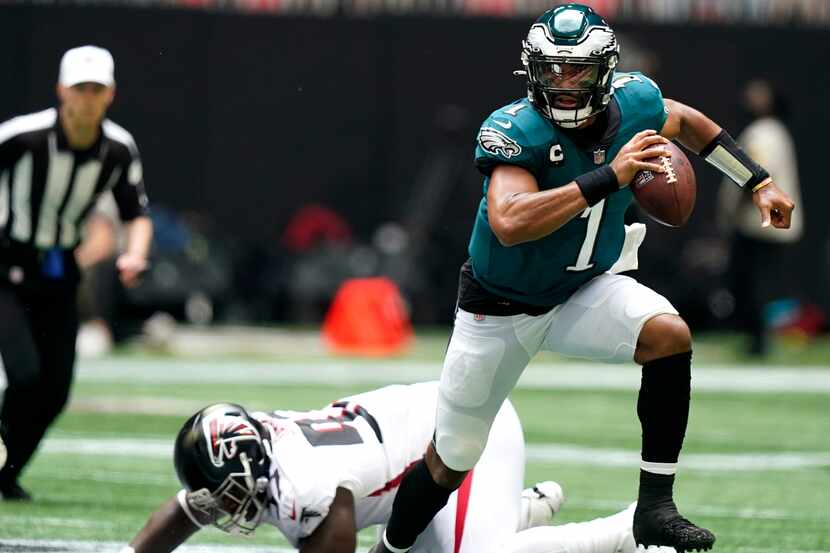 Philadelphia Eagles quarterback Jalen Hurts (1) breaks out of the pocket against the Atlanta...