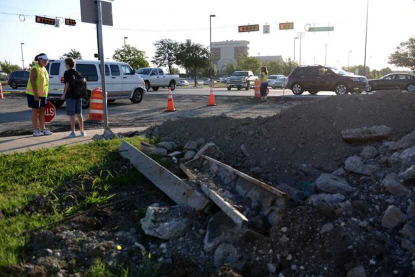 
Cars travel across the Murphy Road and Spring Ridge Drive intersection near McMillan High...