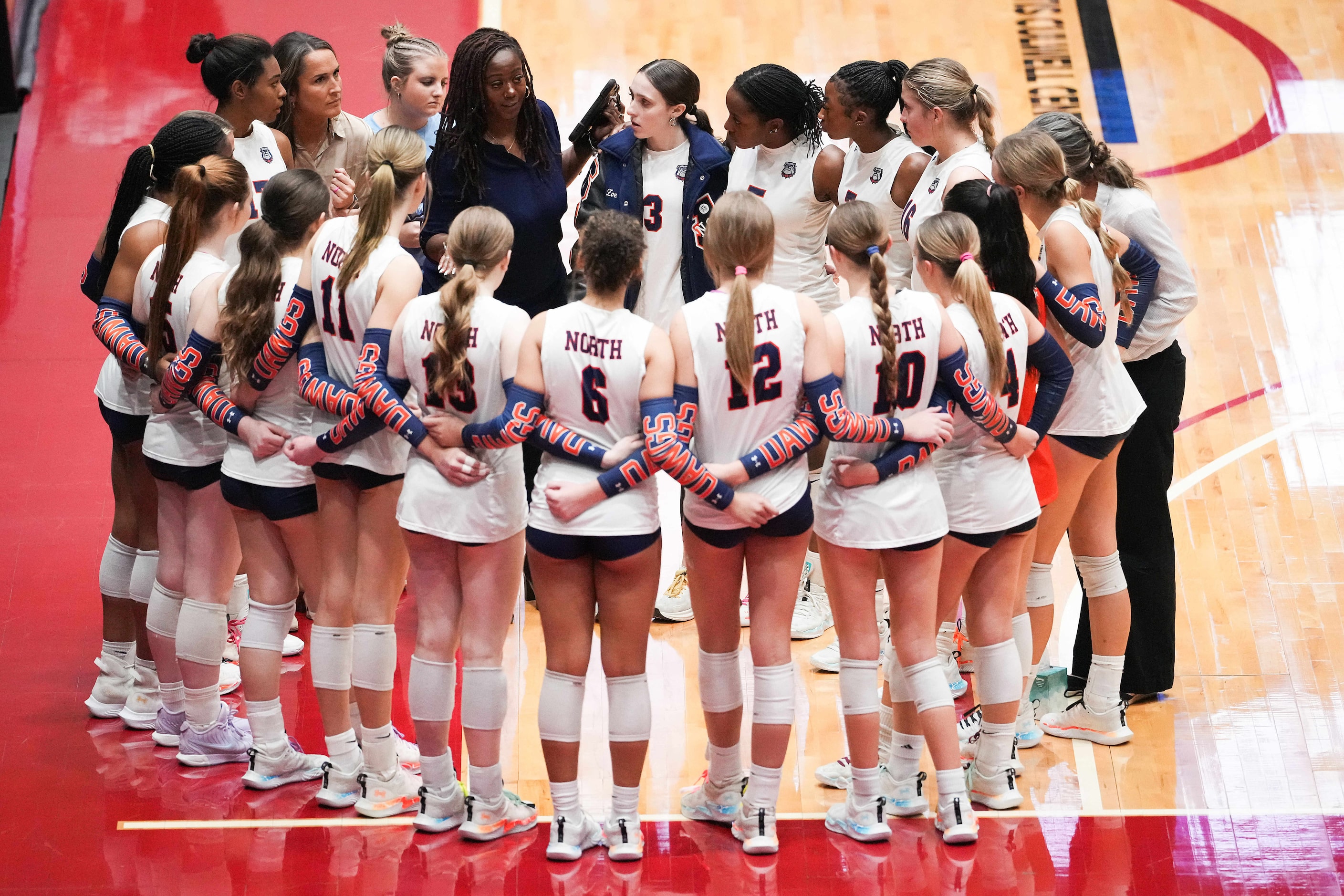 McKinney North players huddle between sets during the UIL Class 5A Division I volleyball...