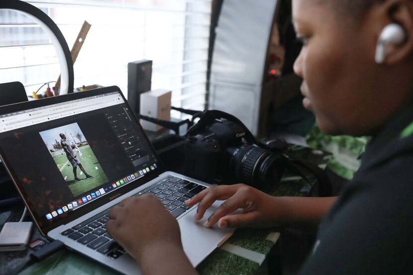 Isaac Edwards, 13, shows his edits on a photo he took of former Dallas Cowboys star DeMarcus...
