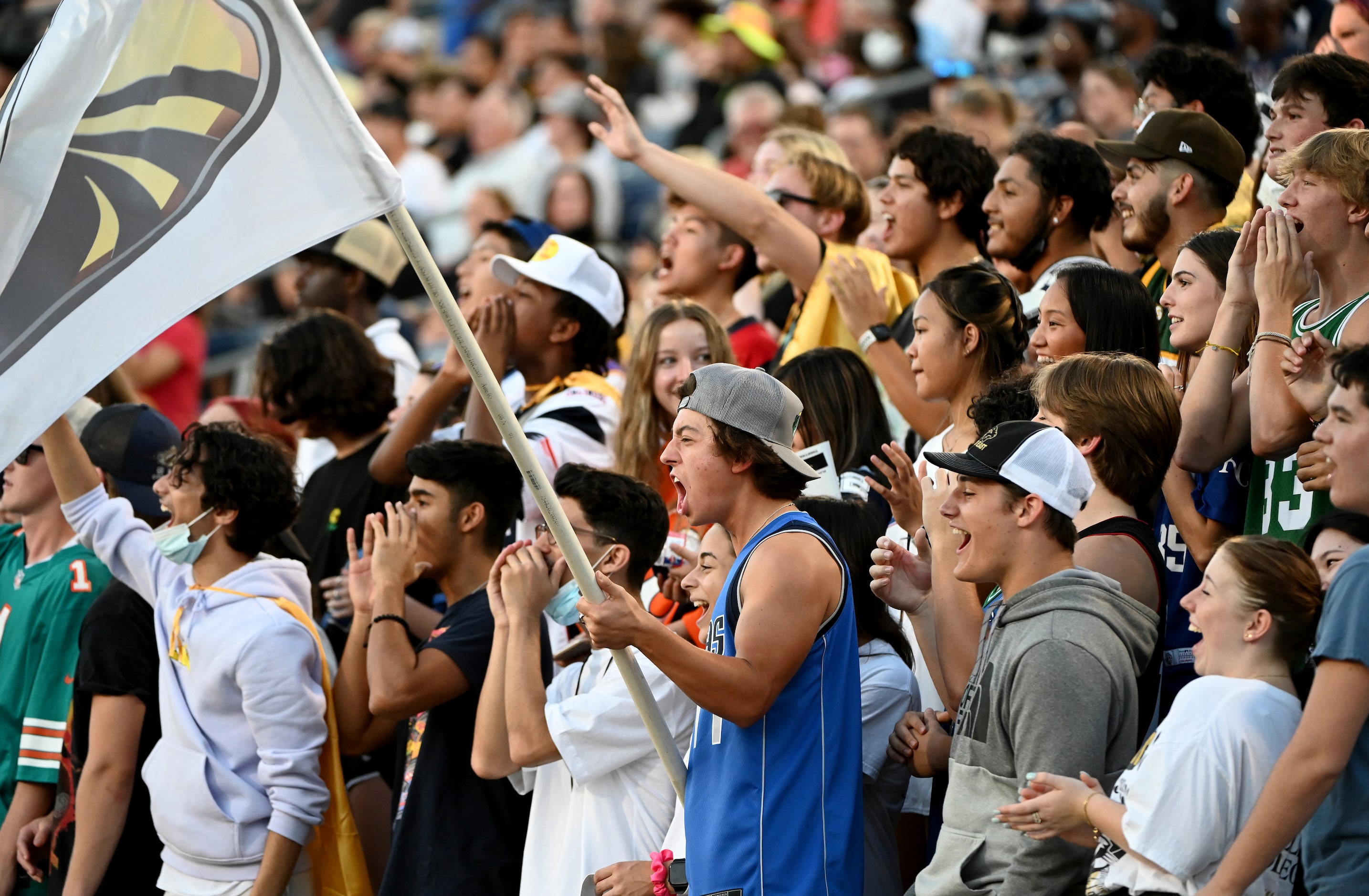 Plano East student cheer in the first half during a high school football game between Plano...