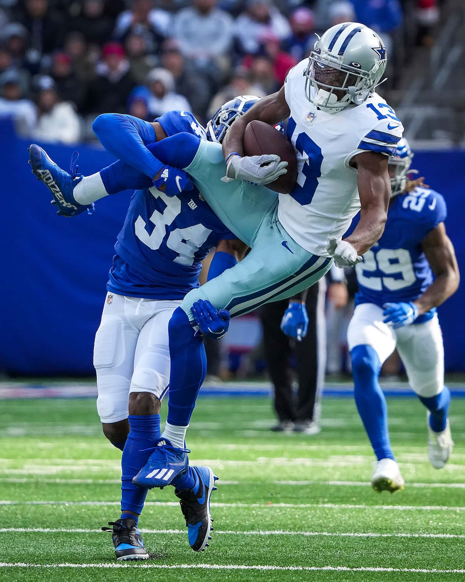 Dallas Cowboys wide receiver Michael Gallup (13) makes a catch for a first down as New York...