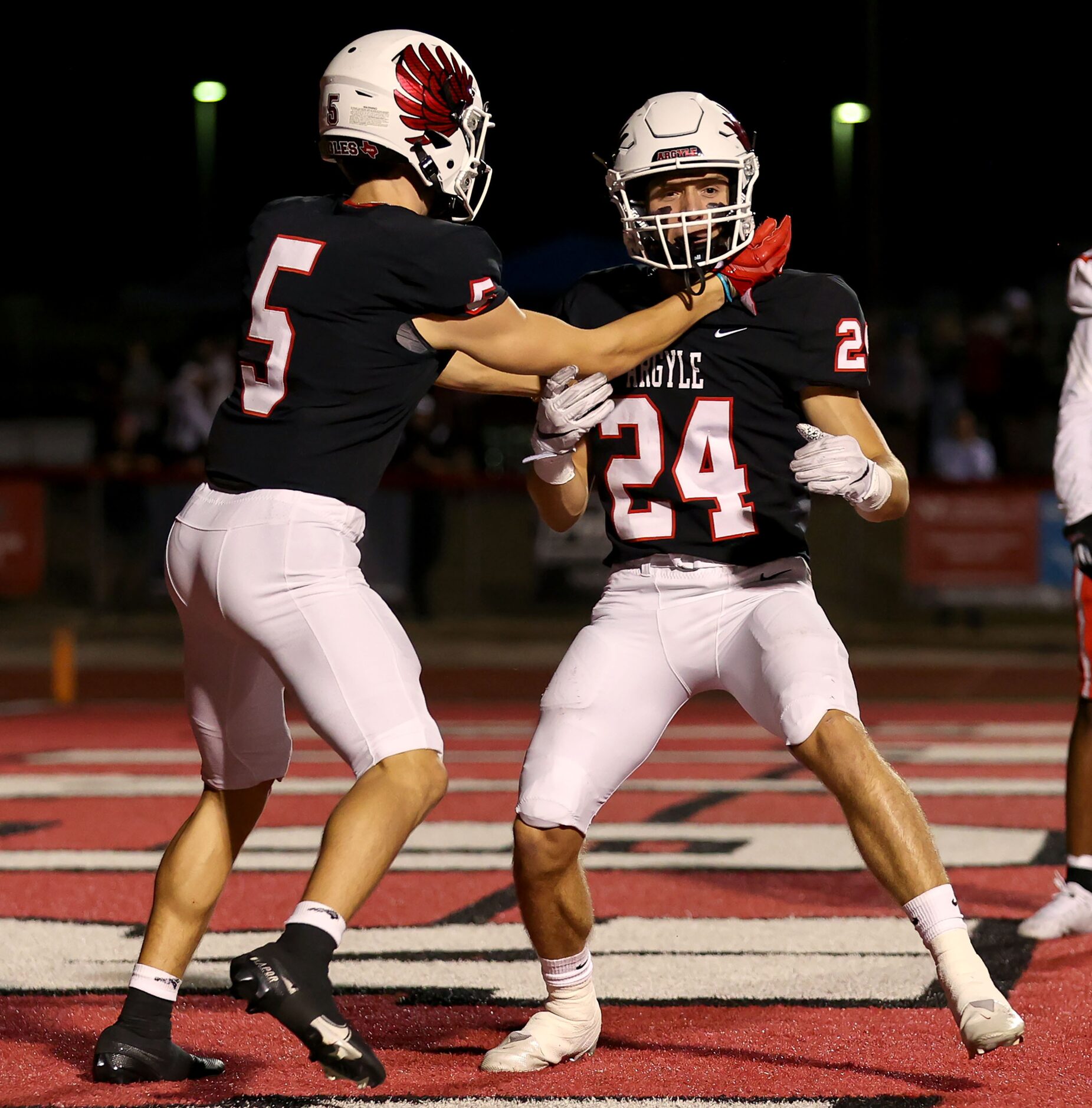 Argyle wide receiver Hayden Stewart (5) and wide receiver Riley Page (24) celebrate a...