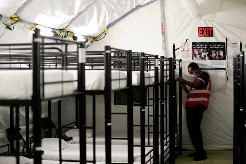 A staff member worked in the infirmary, a series of tents, at the U.S. government's newest...
