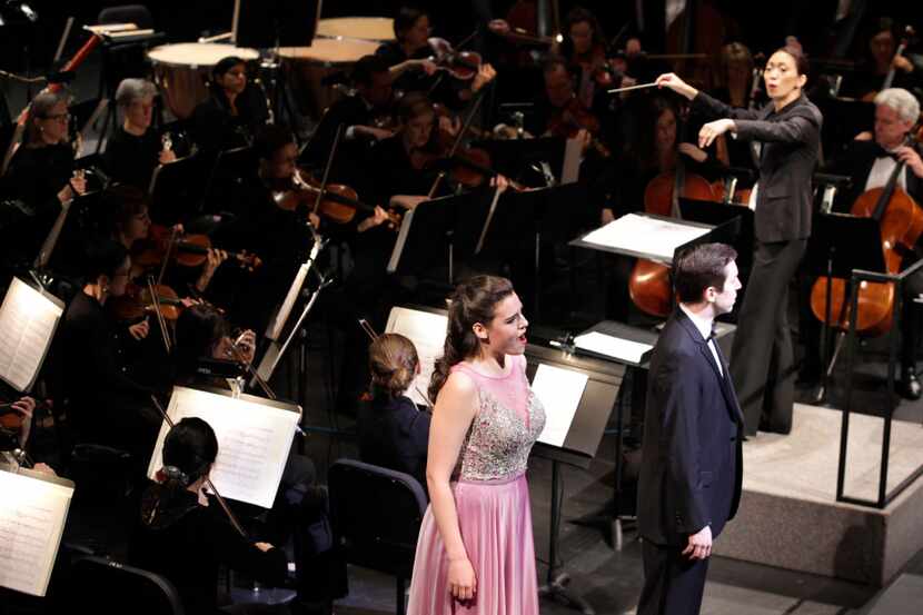 Chaowen Ting, with soprano Kirsten MacKinnon and tenor Jonas Hacker, conducts during the...