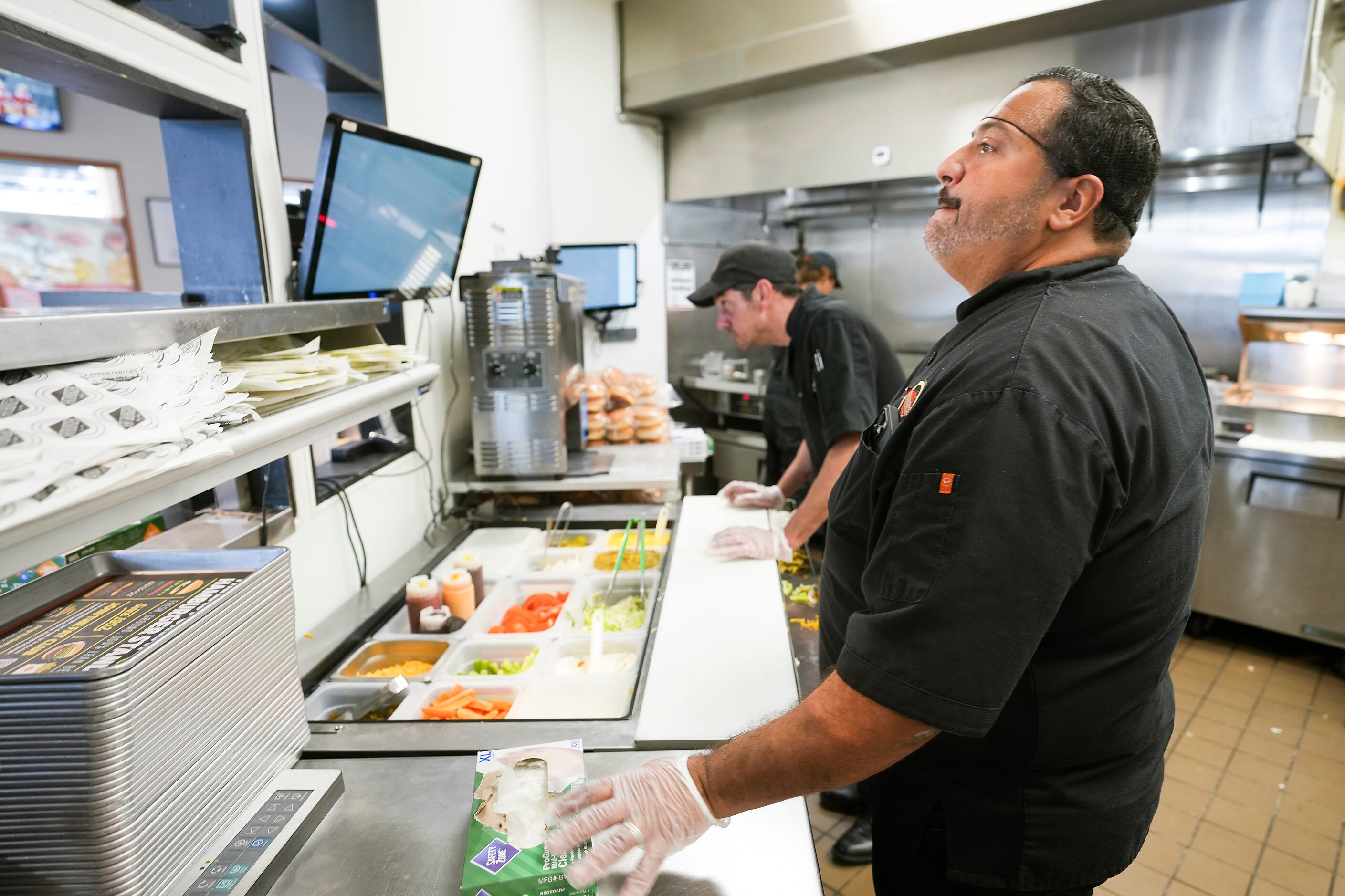 Owner Alf Gonzalez works in the kitchen of Fatburger at the Allen Premium Outlets on...