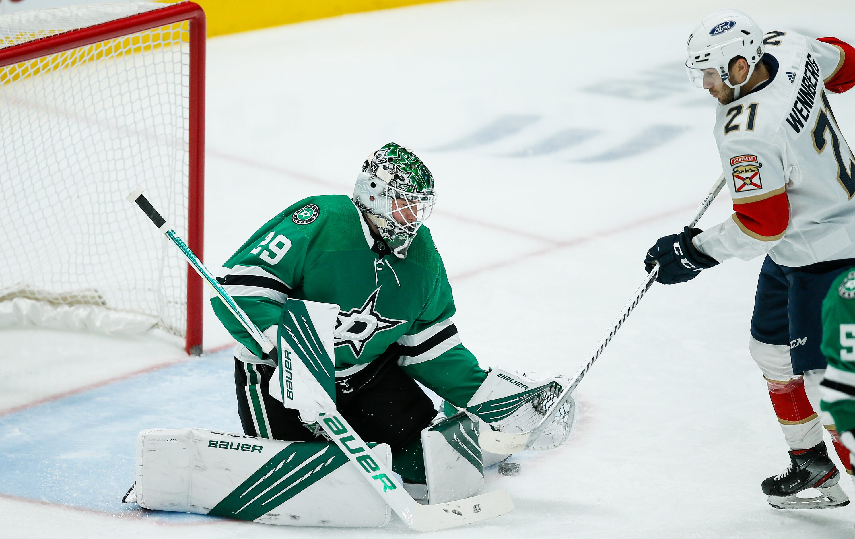 Florida Panthers forward Alex Wennberg (21) looks for a rebound off of Dallas Stars...