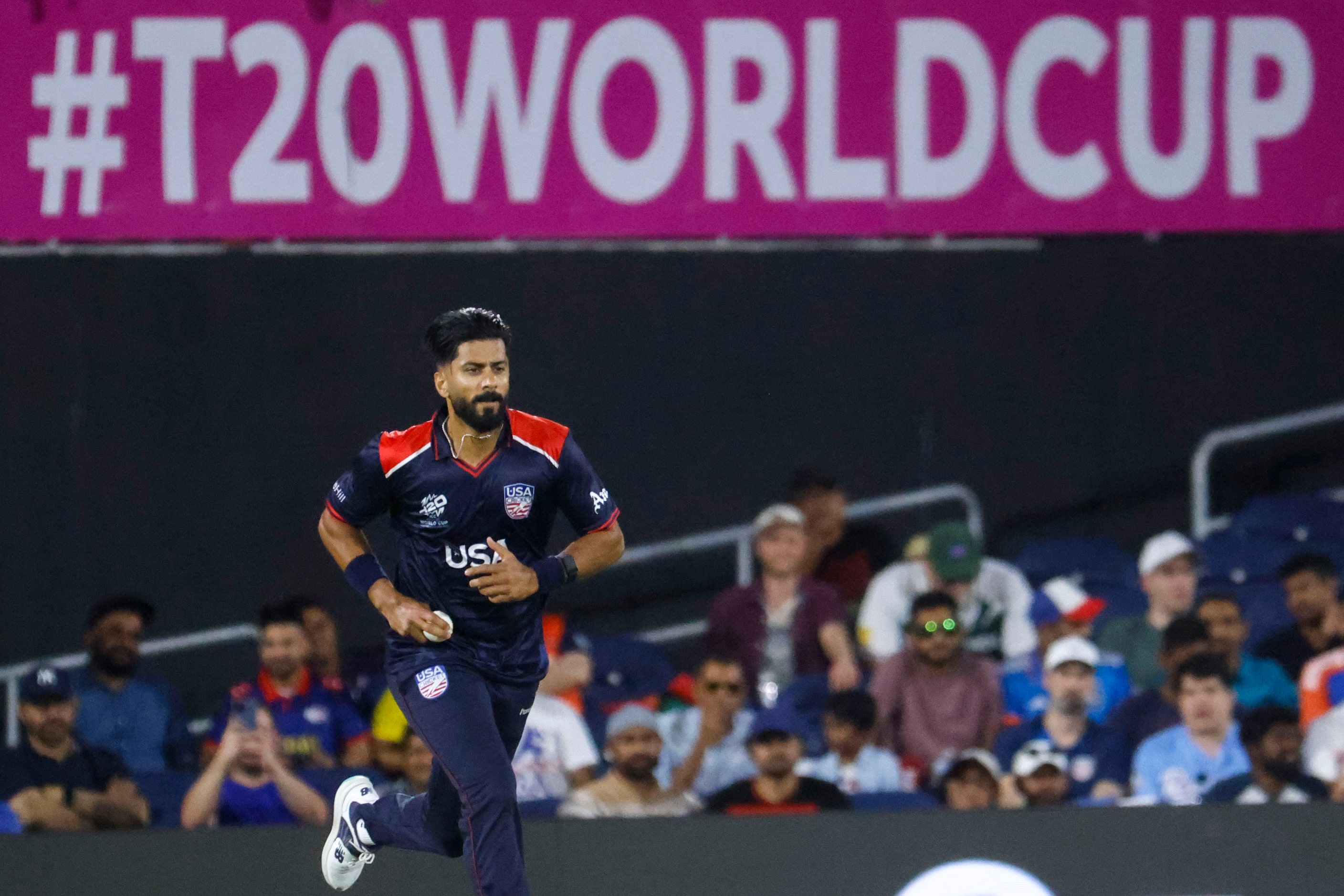 United States' Muhammad Ali-Khan bowls during the men's T20 World Cup cricket match against...