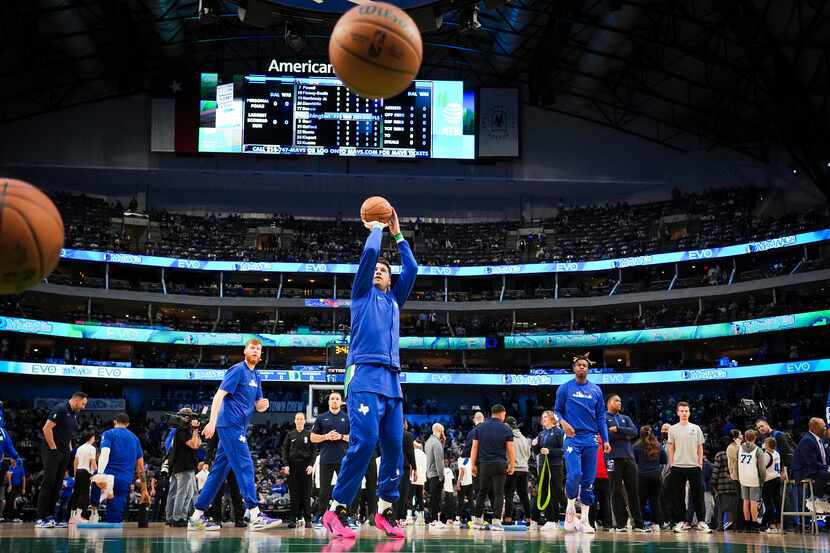 Dallas Mavericks guard Luka Doncic warms up before an NBA basketball game against the...