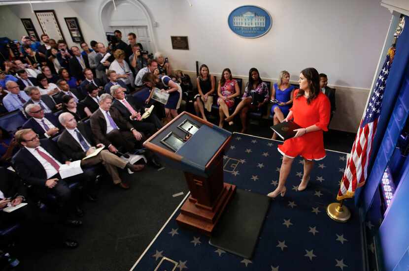 Sarah Huckabee Sanders who has been named White House press secretary walks to the podium...