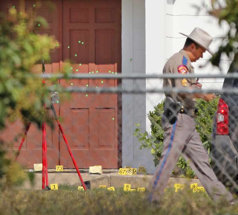 The front door of the First Baptist Church in Sutherland Springs shows multiple markings for...