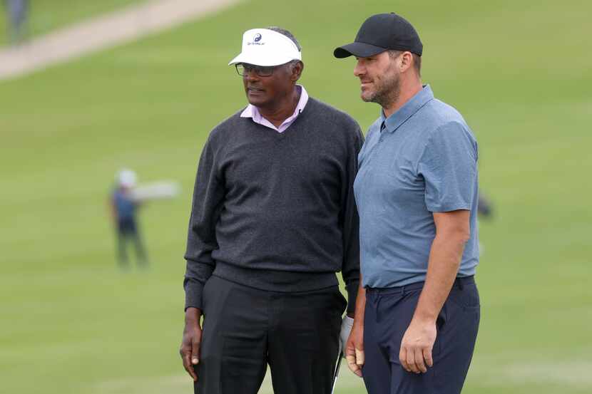 Professional Golfer Vijay Singh talks with former Dallas Cowboys quarterback Tony Romo...