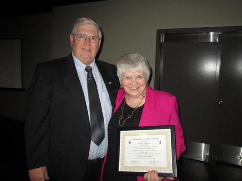 
Mary Higbie with her brother, Dennis Helfin, after receiving her award from the Irving...