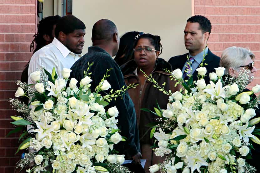 Cowboys player Josh Brent (far left) leaves Oak Cliff Bible Fellowship with others,...